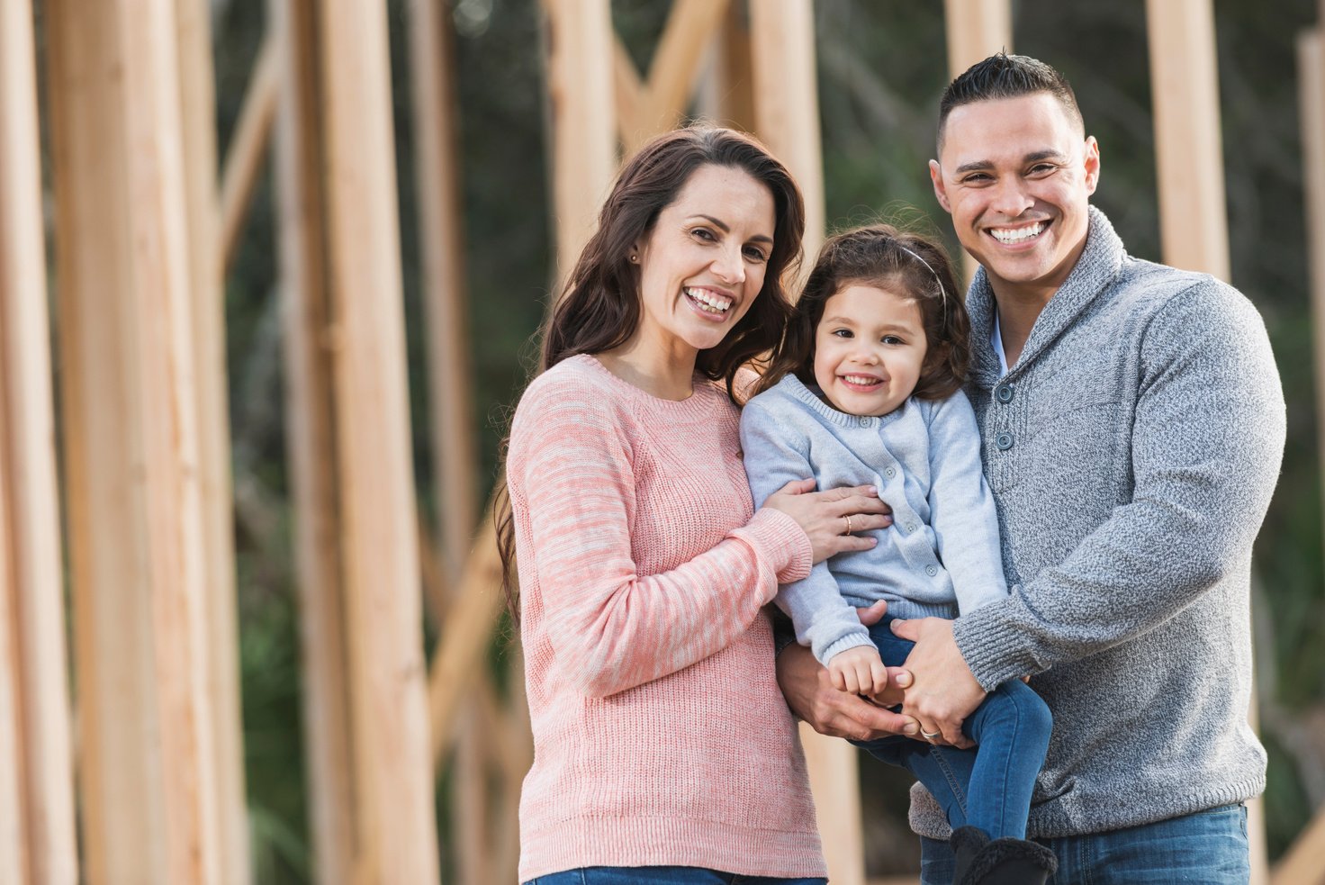 Hispanic family building a new home